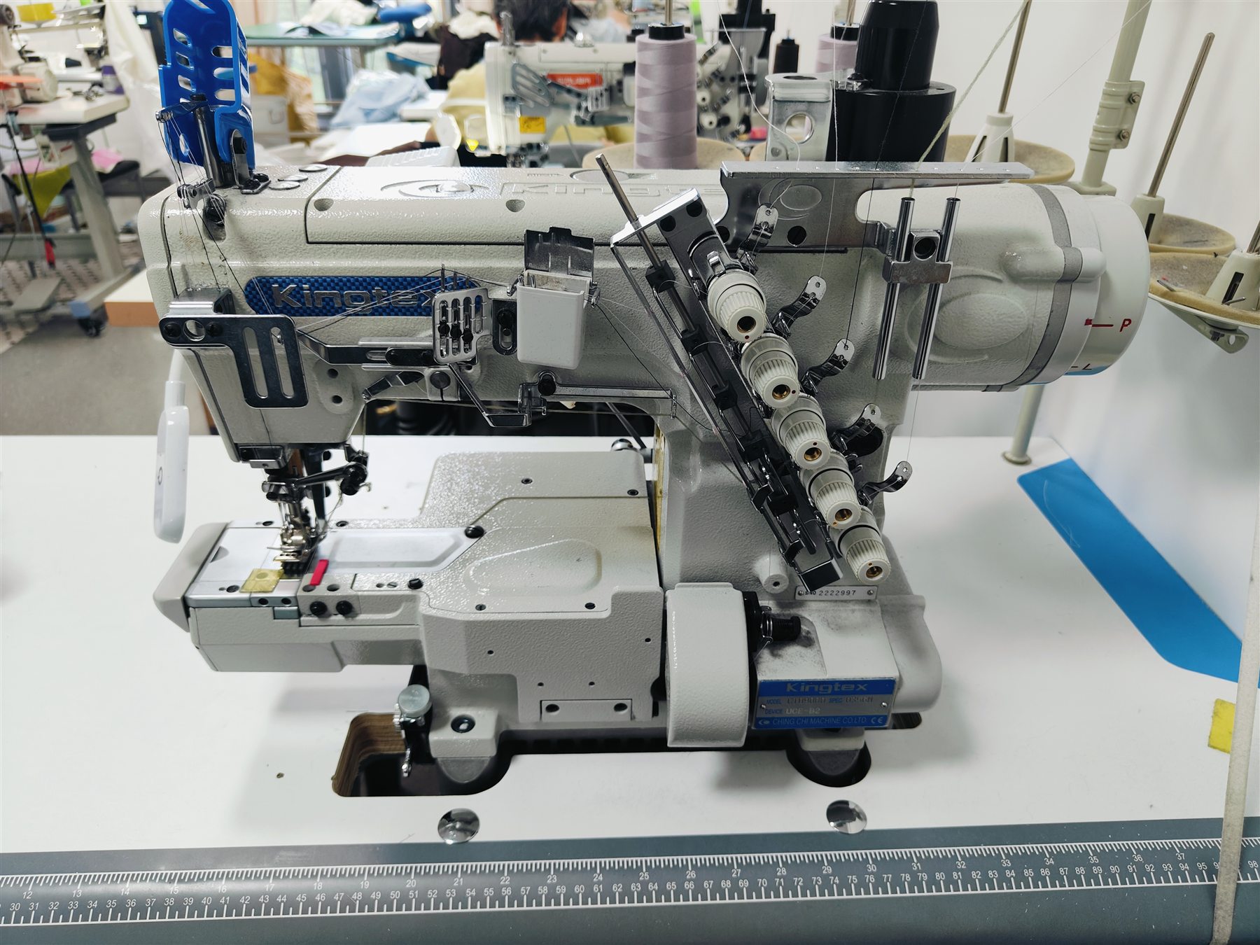 Industrial coverstitch sewing machine on the FG Knitwear production floor