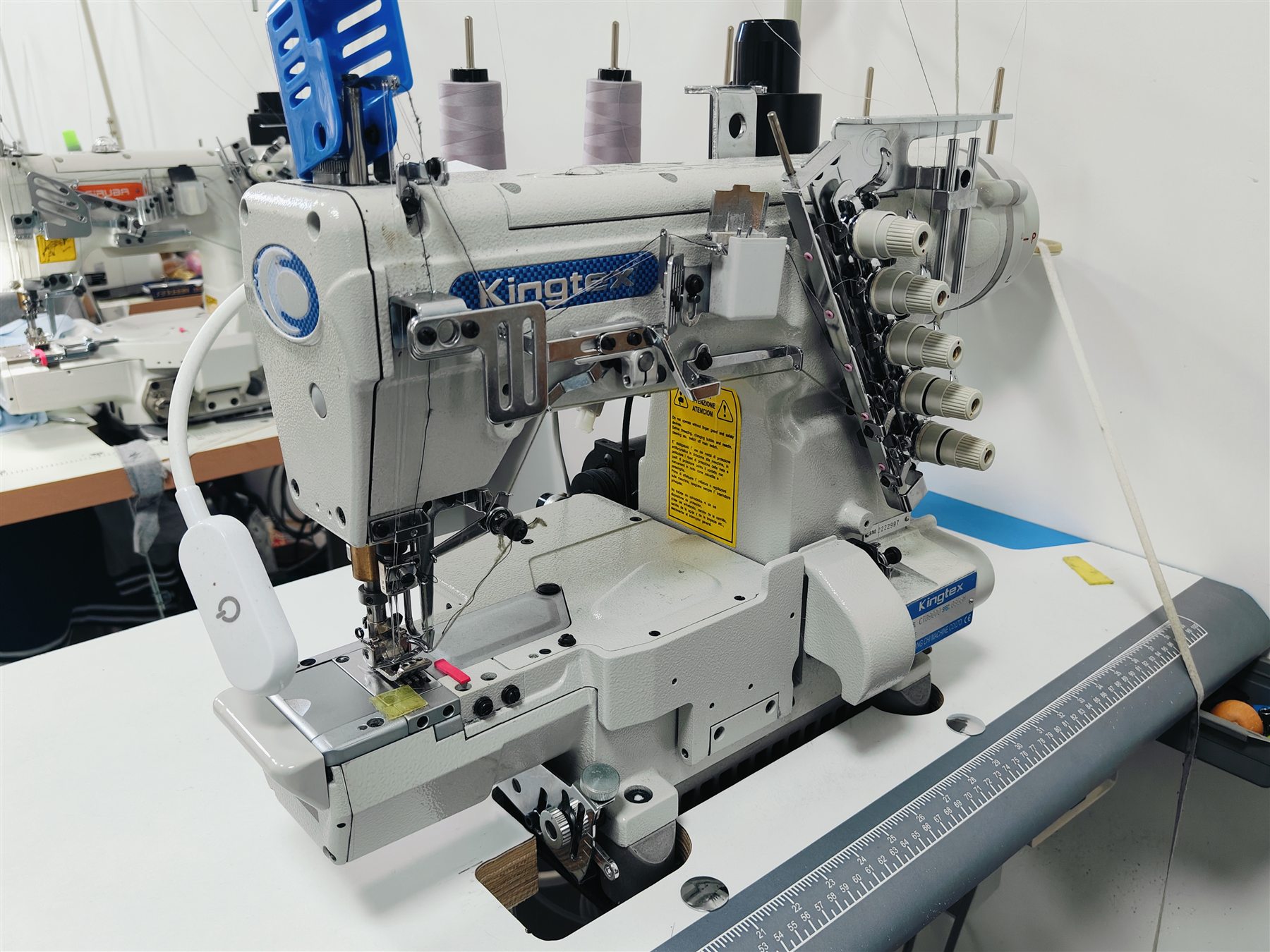 Industrial coverstitch equipment ready on the factory floor