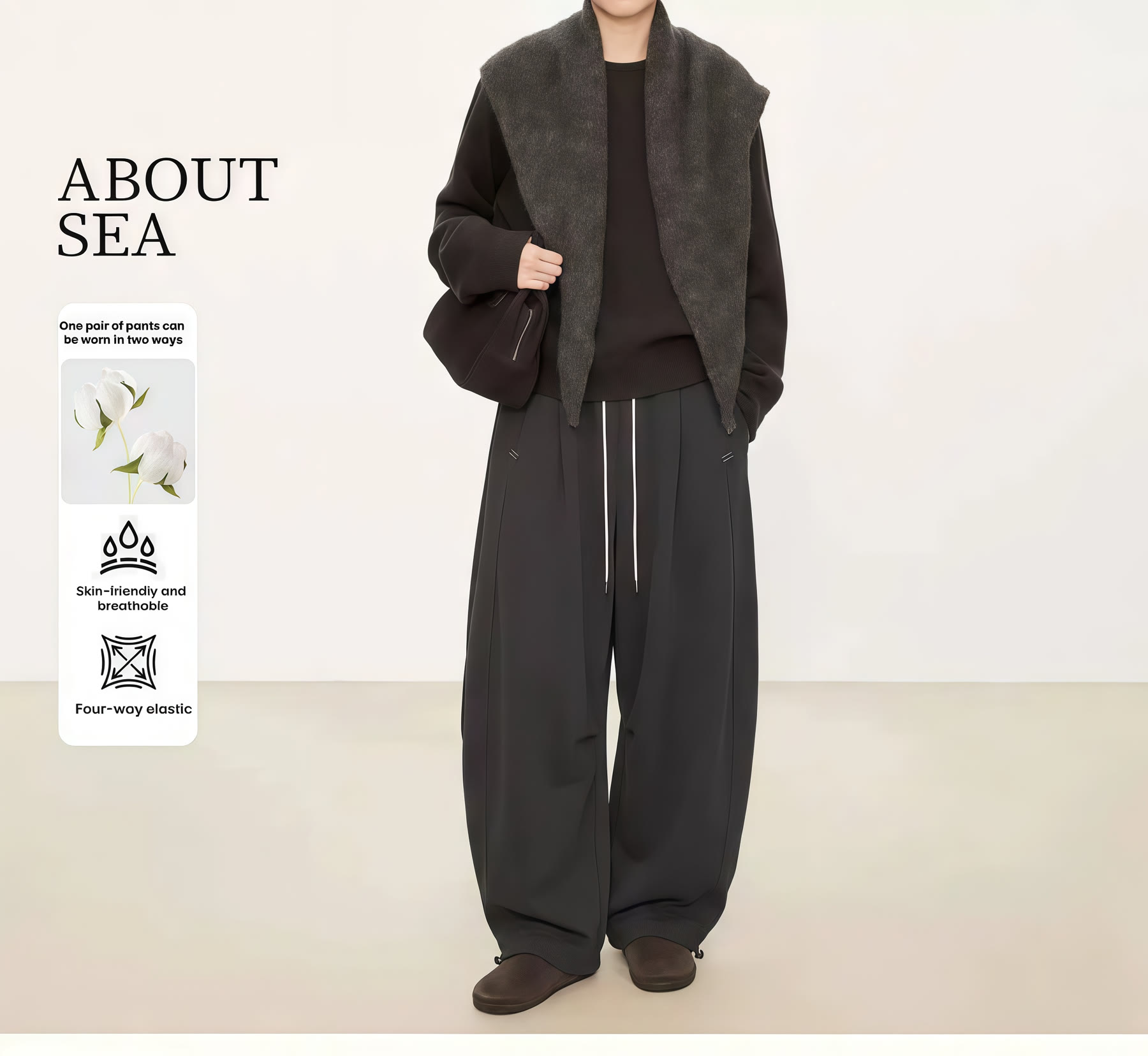 Black layered outerwear and relaxed trouser styling reference