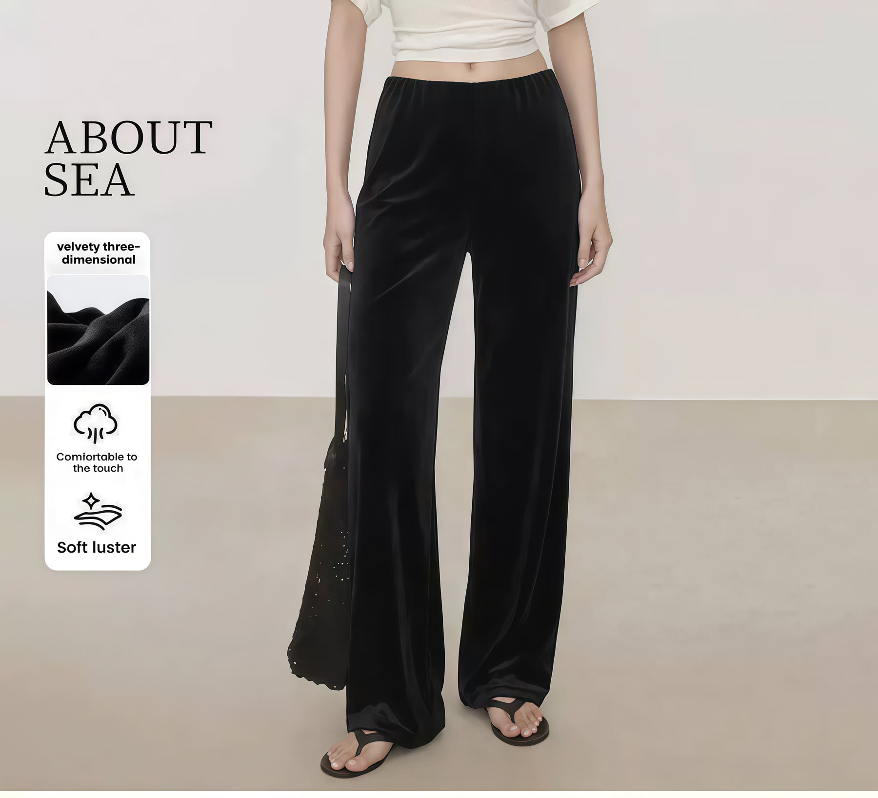 Black wide-leg trousers shown with silhouette and finish details