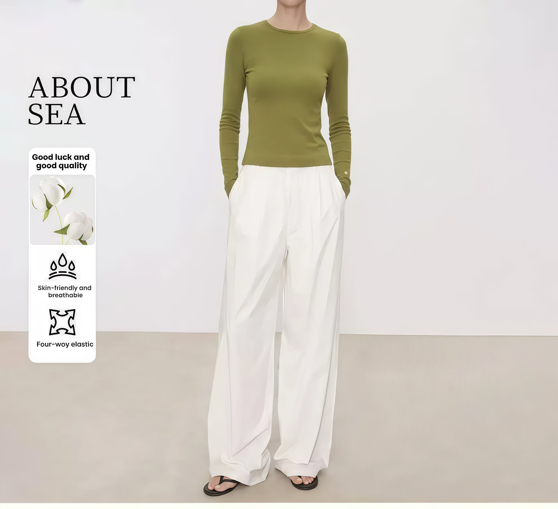 Green long-sleeve top styled with white wide-leg trousers