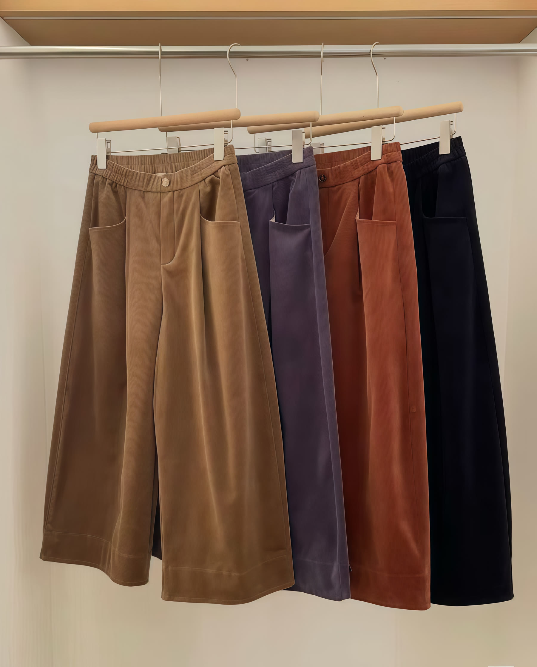 Wide-leg trousers displayed in camel, lilac, rust and black colourways